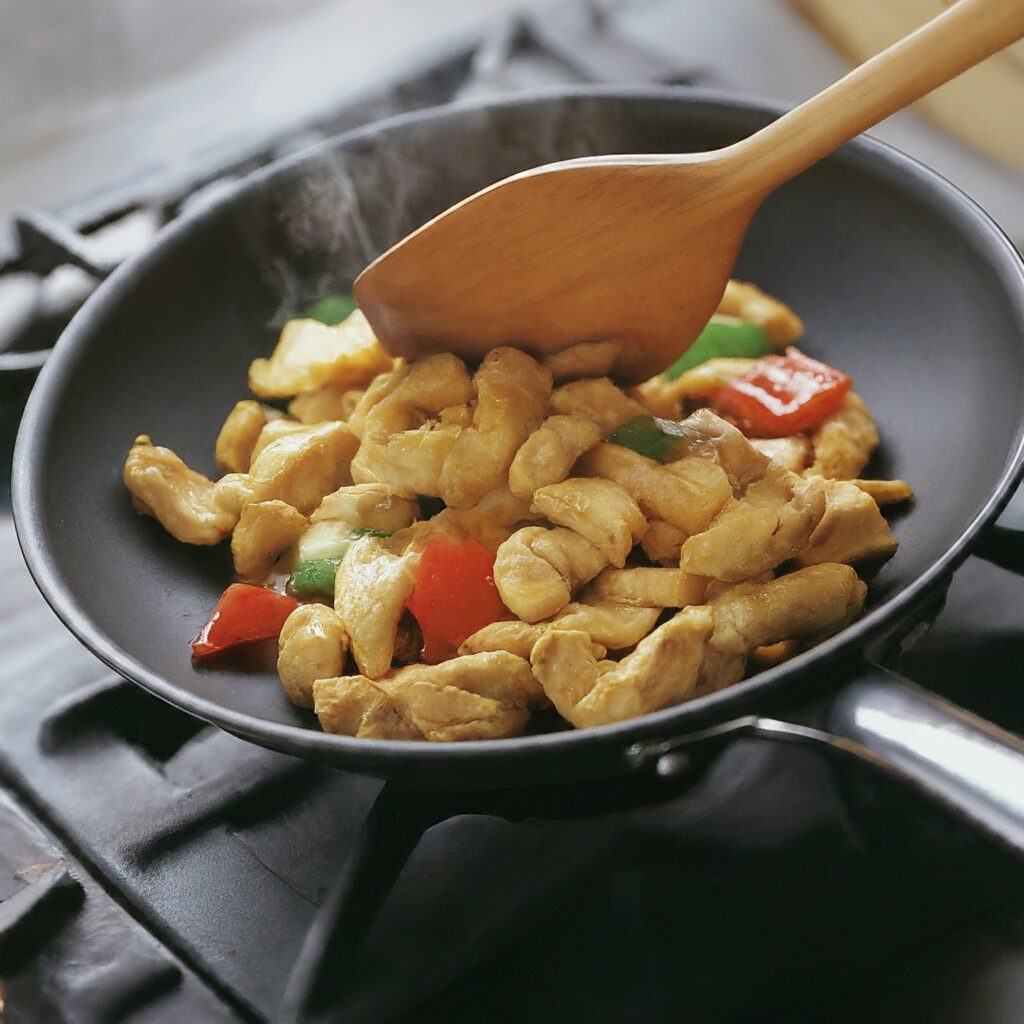 Stir frying the chicken 